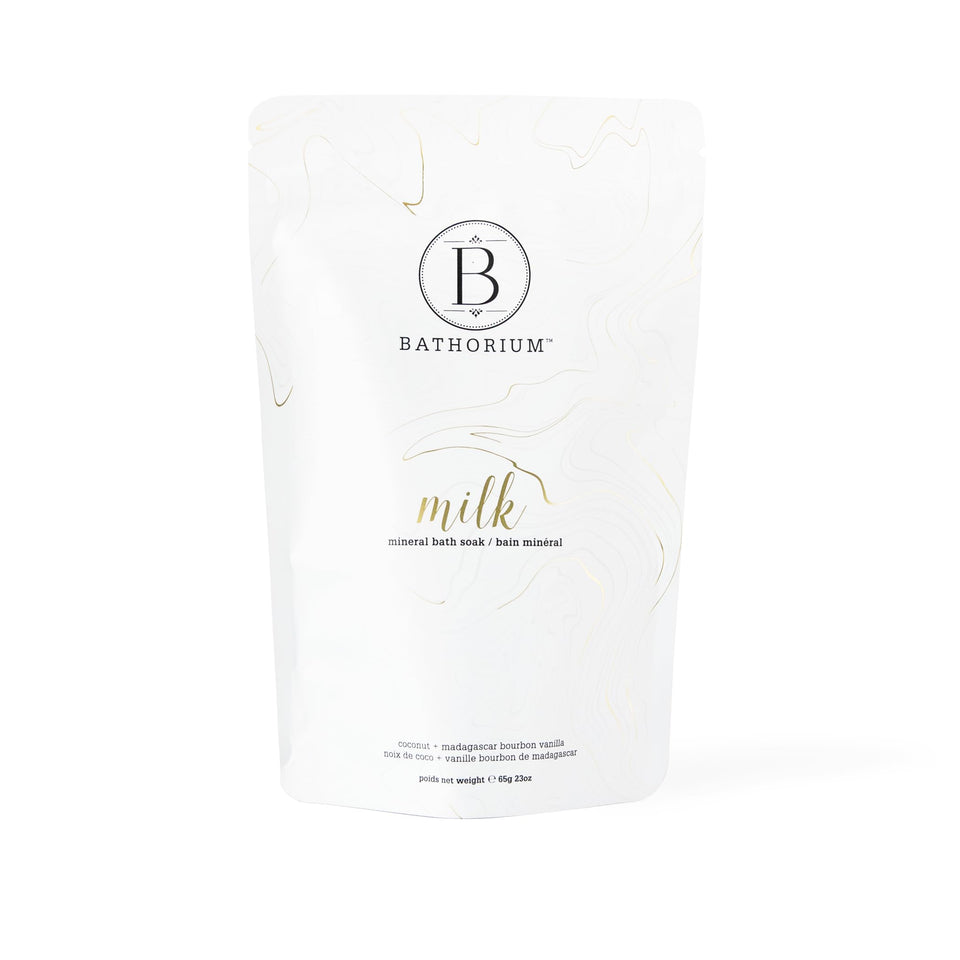 Bathorium Milk Mineral Bath Soak bottle with coconut highlights gentle hydration for sensitive skin.