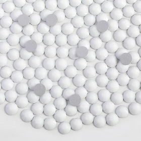 Beadsland flat-back glass rhinestones showing precise cuts for glue adhesion.