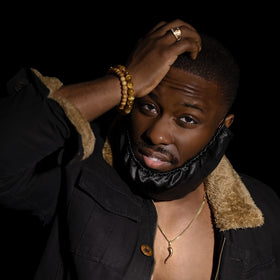 Beard Bonnet covering beard while applying oil for better absorption.