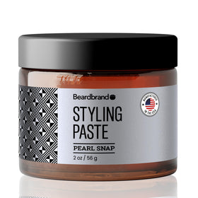 Beardbrand beard styling paste jar closeup showing premium medium-hold formula for beard and hair