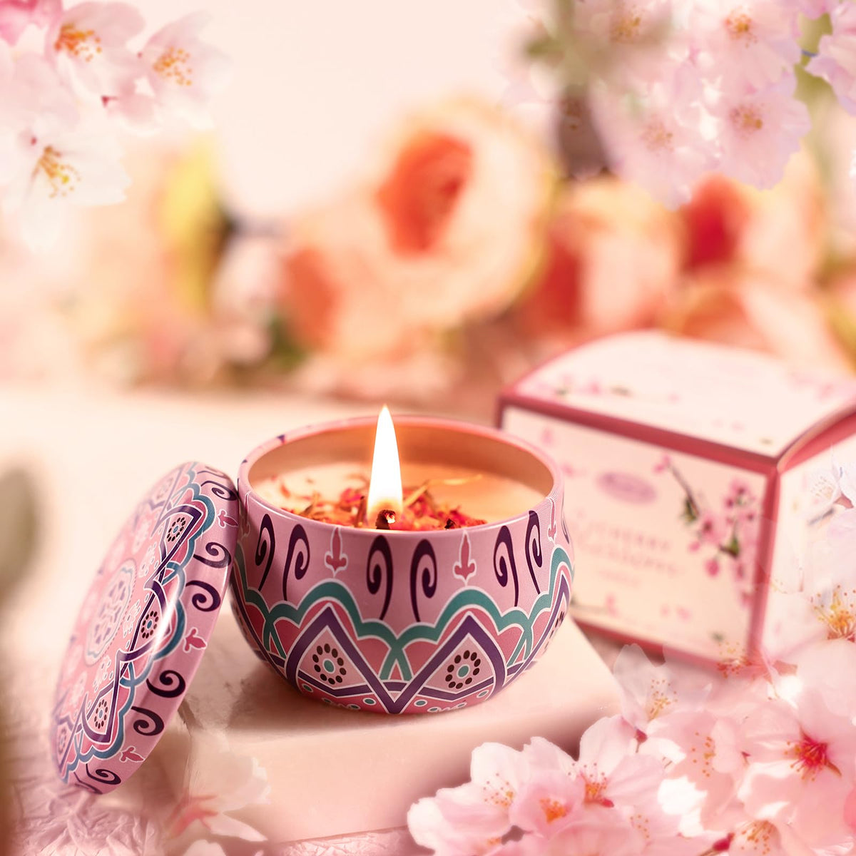 Beautifier Life candle casts warm light with cherry blossom scent.