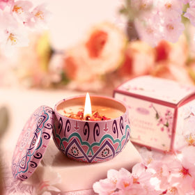 Beautifier Life candle casts warm light with cherry blossom scent.