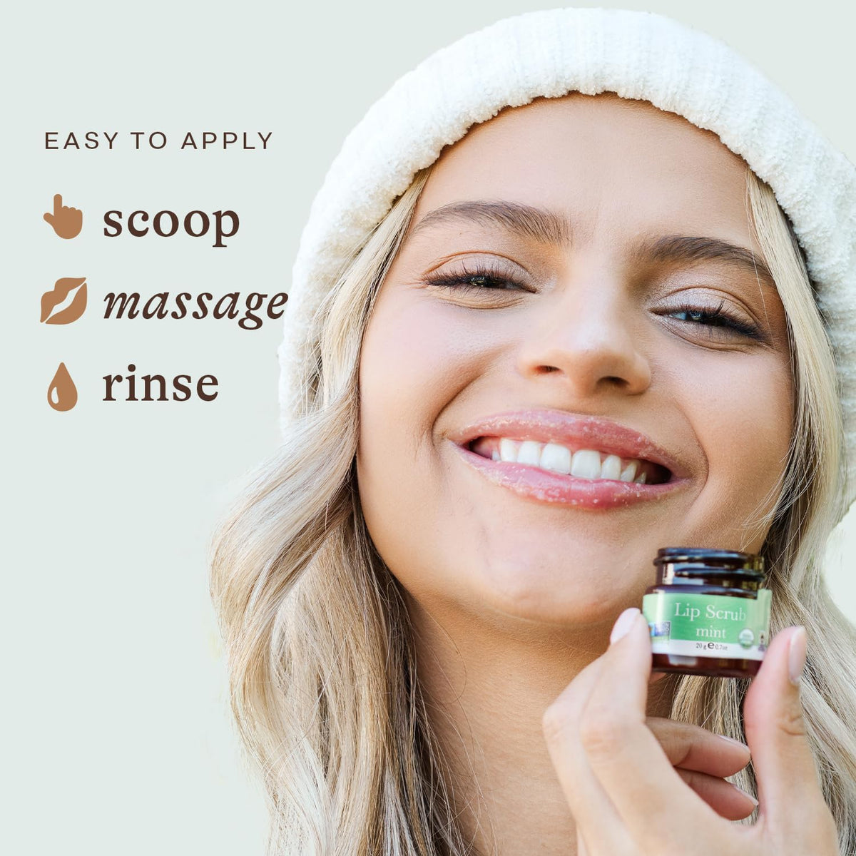 Beauty by Earth mint lip scrub closeup shows sugar grains and mint leaves