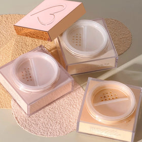 Compact of Beauty Creations loose setting powder ready for on-the-go touch-ups