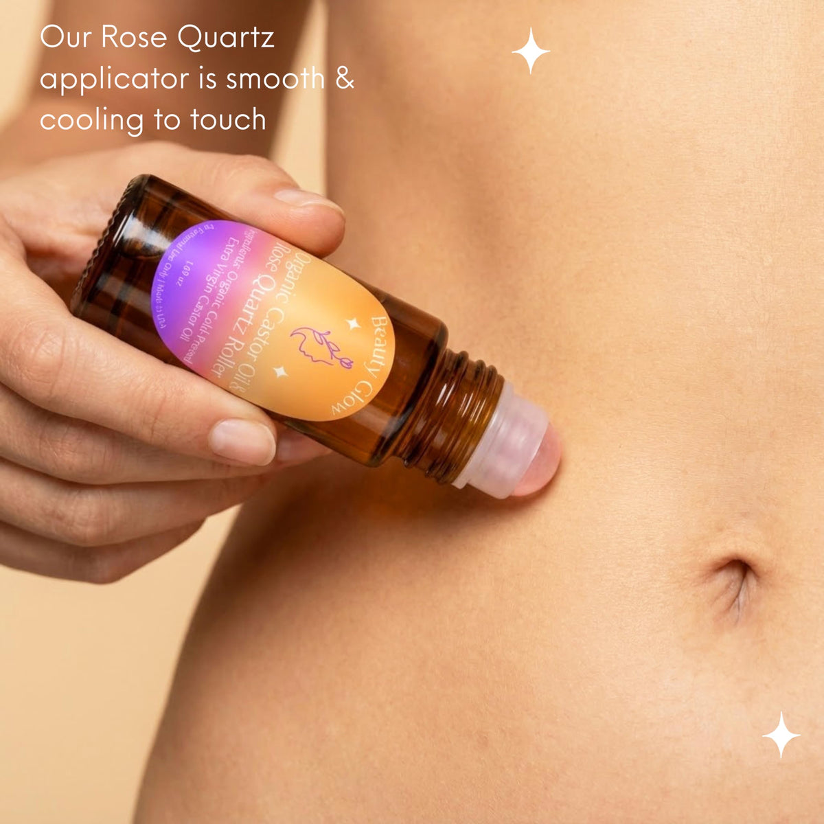 Rose quartz roll-on applying castor oil to face for smooth absorption