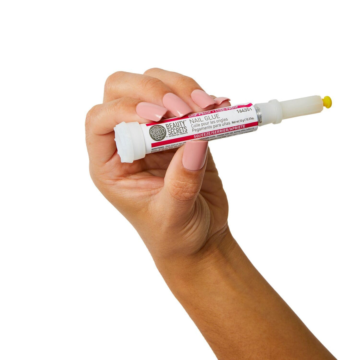 Beauty Secrets repair glue application close-up for mending nails.