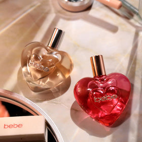 Bebe Luxe Wild bottle on dresser highlights elegant display for perfume collection