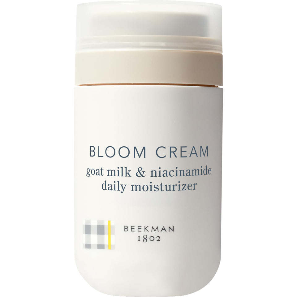 Beekman 1802 Bloom Cream jar close-up for instant hydration.