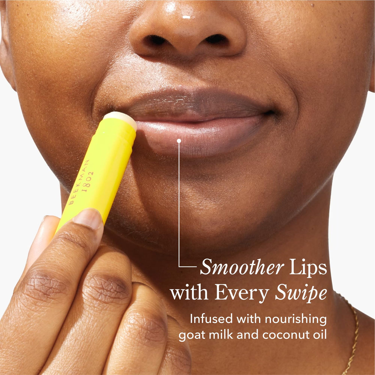 Close-up of Beekman 1802 lip balm tubes highlighting creamy texture.