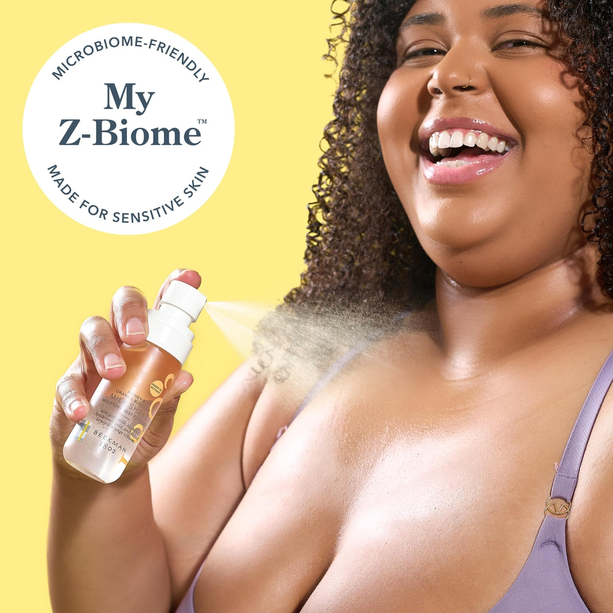 Beekman 1802 Milk Shake Hydrating Body Mist misting onto skin during shower routine.