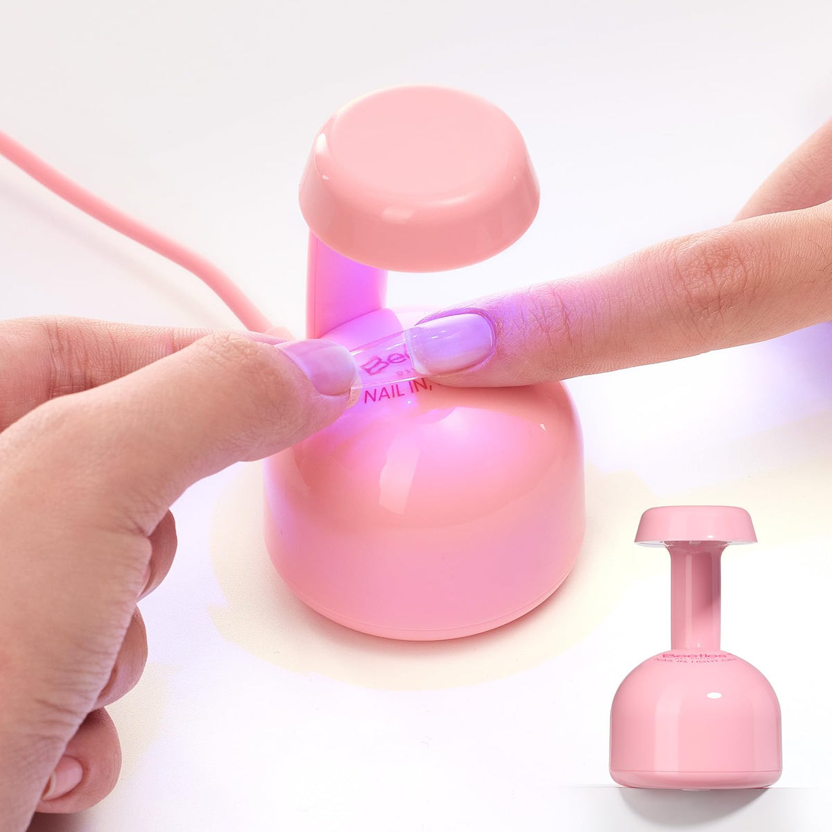 Beetles Mini UV Light focusing on nail tips for quick gel extension