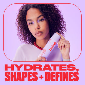 BEING CURL POWER MOUSSE applied to damp hair for smoothing and movement.