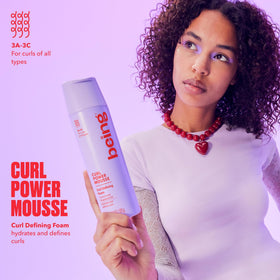 Close-up of BEING CURL POWER MOUSSE dispensing pump for easy application.