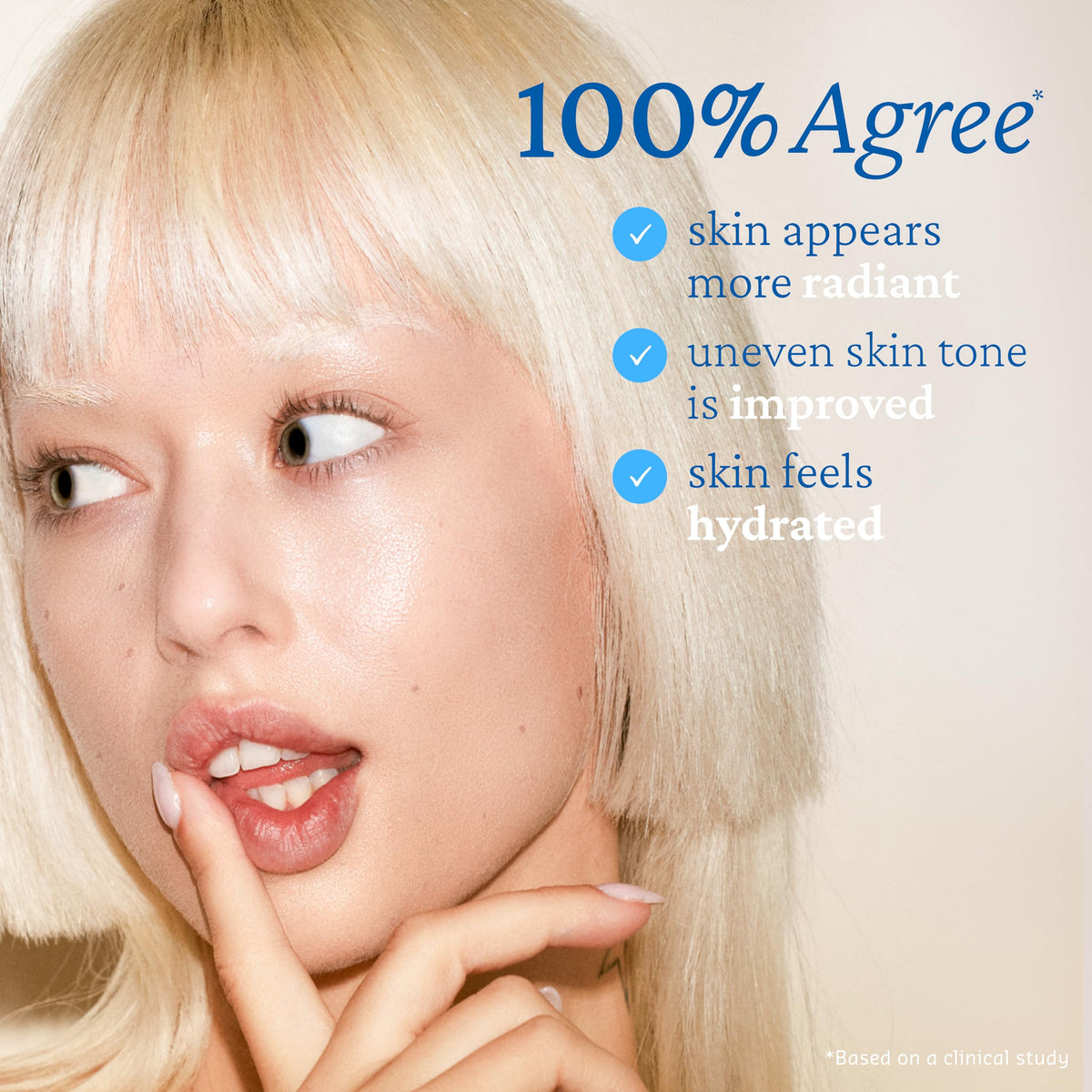 Belif Vitamin C Golden Glow Serum swatch showing micro-pearls on cheek.
