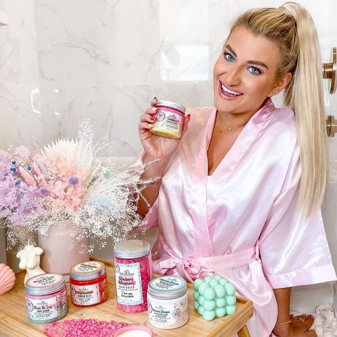 Hands applying Bella and Bear Goddess Sugar Scrub for even coverage.