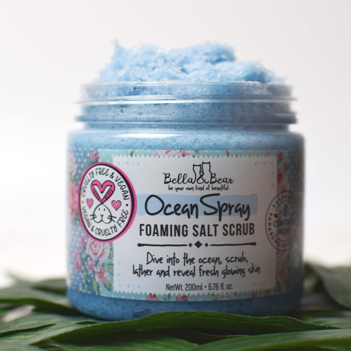 Close-up of Ocean Spray Scrub label, highlighting cruelty-free badge and clean ingredients.