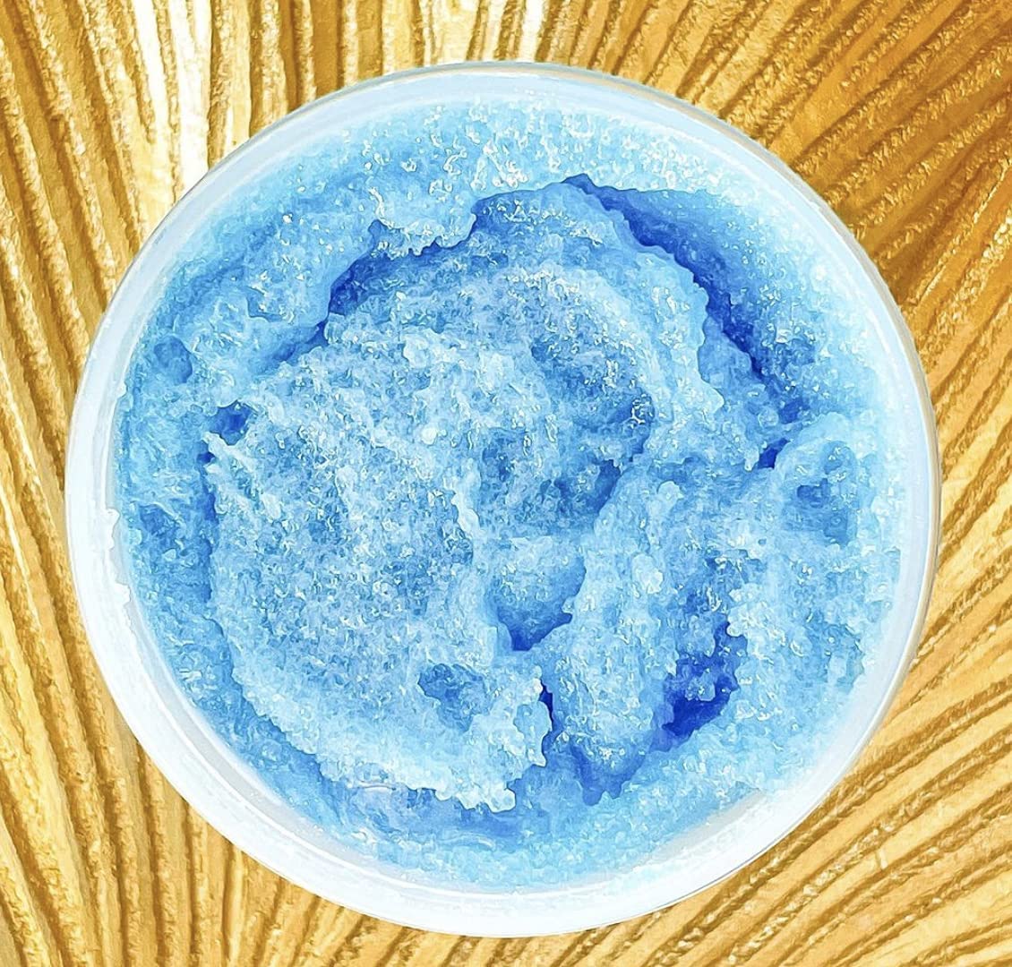 Ocean Spray Scrub texture close-up showing exfoliating particles for smoother skin.
