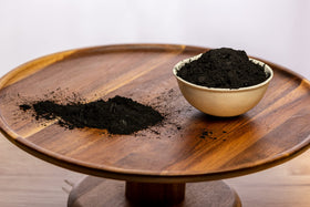  Belle Chemical coconut activated charcoal powder depicted for teeth whitening demonstration