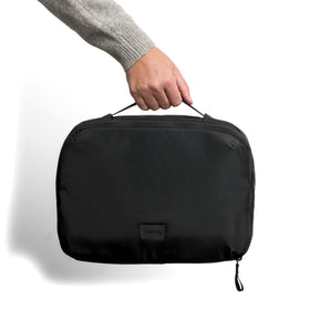 Bellroy Hanging Toiletry Kit Plus aluminum hook allows hands-free hanging over doors.
