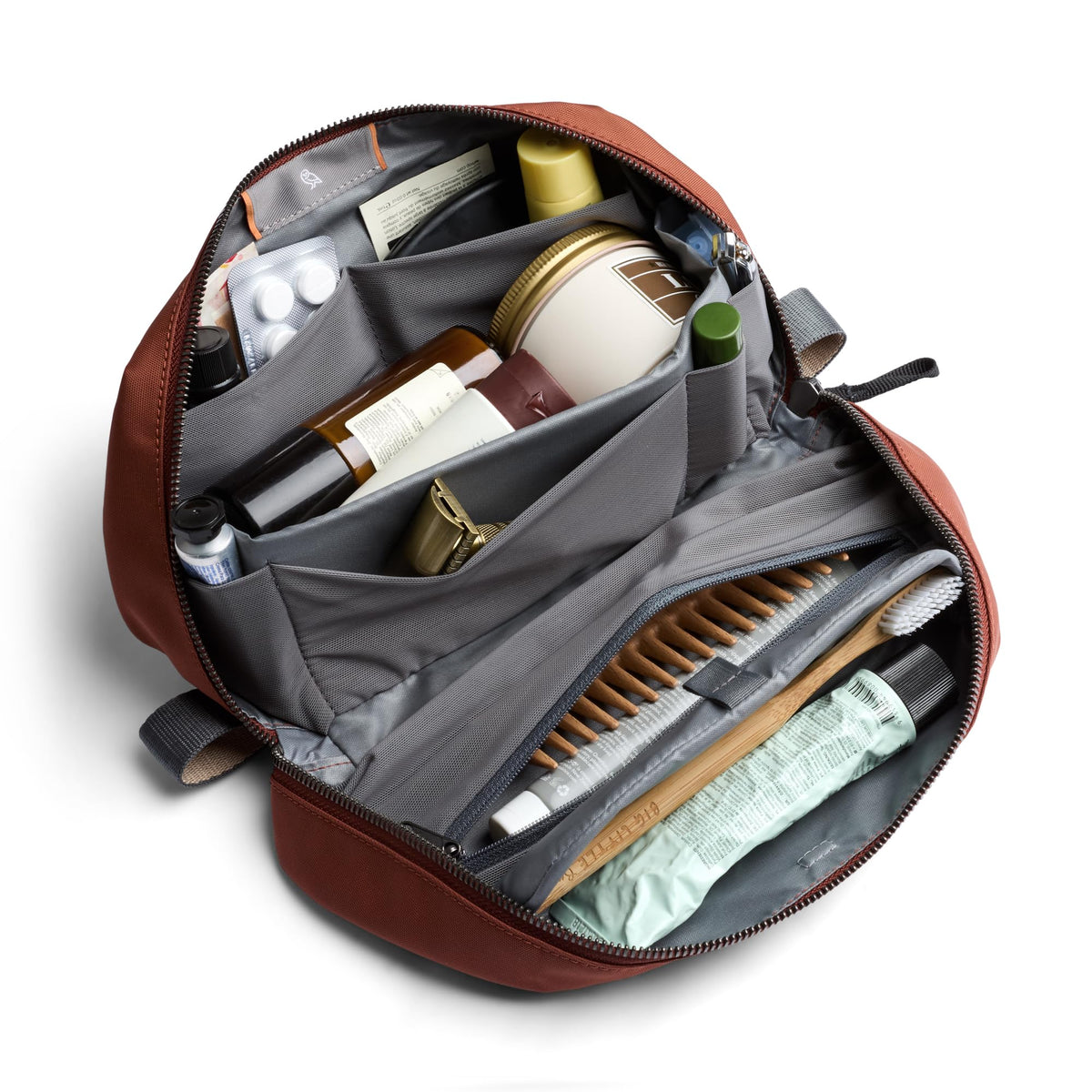 Bellroy Toiletry Kit Plus magnetic toothbrush shelf secures an electric toothbrush.