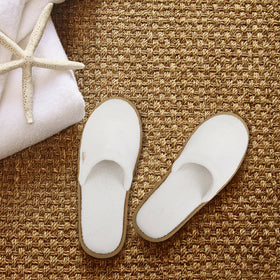 BERGMAN KELLY spa slippers closed-toe white quilted design adds refined guest-room appeal.