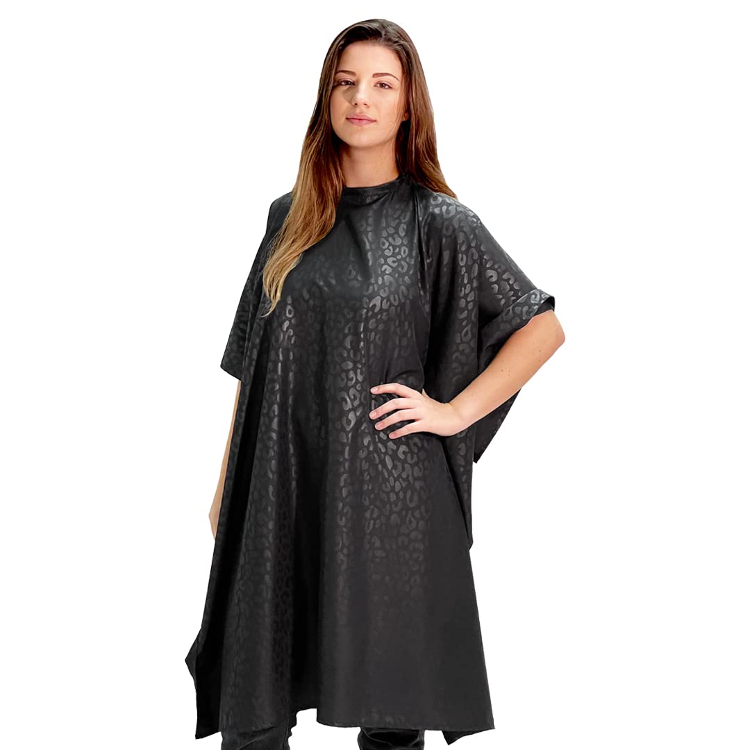 Betty Dain cape side view highlighting lightweight embossed nylon and snap neck.