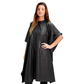 Betty Dain cape side view highlighting lightweight embossed nylon and snap neck.