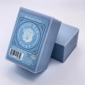 Soap bar resting on wood conveys rustic handcrafted quality
