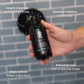 Hands massaging wet hair with Billy Jealousy Monsoon Mist Tea Tree Shampoo