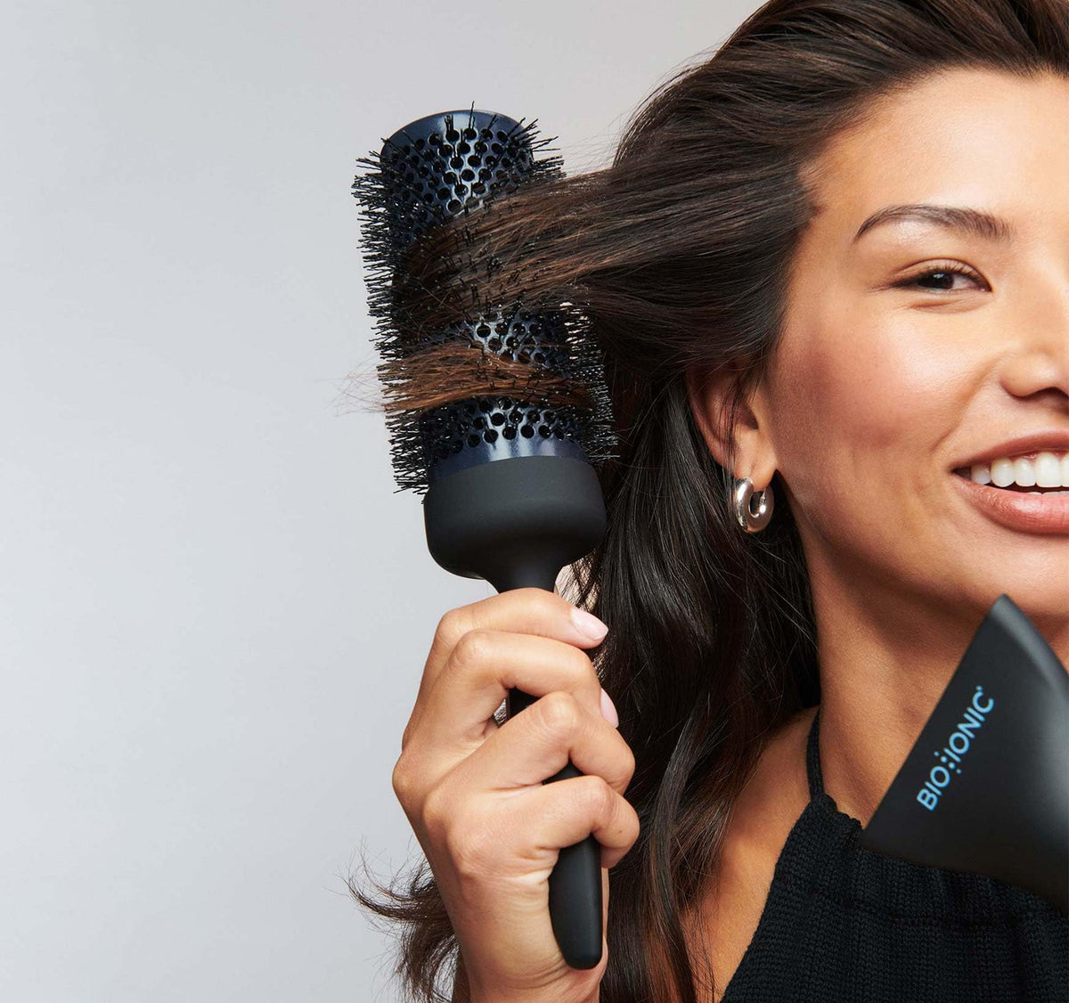 BIO IONIC Graphene MX styling brush with ergonomic grip for comfortable styling sessions.