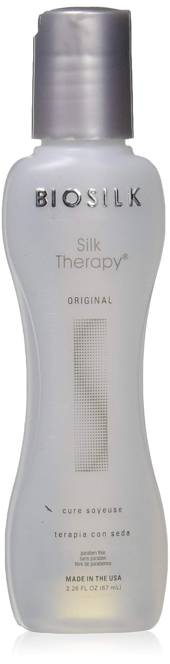 BioSilk Silk Therapy bottle pouring, replenishing leave-in treatment for strengthened hair.