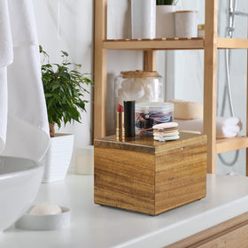Bivvclaz face towel holder keeps towels dry and tidy on counter.