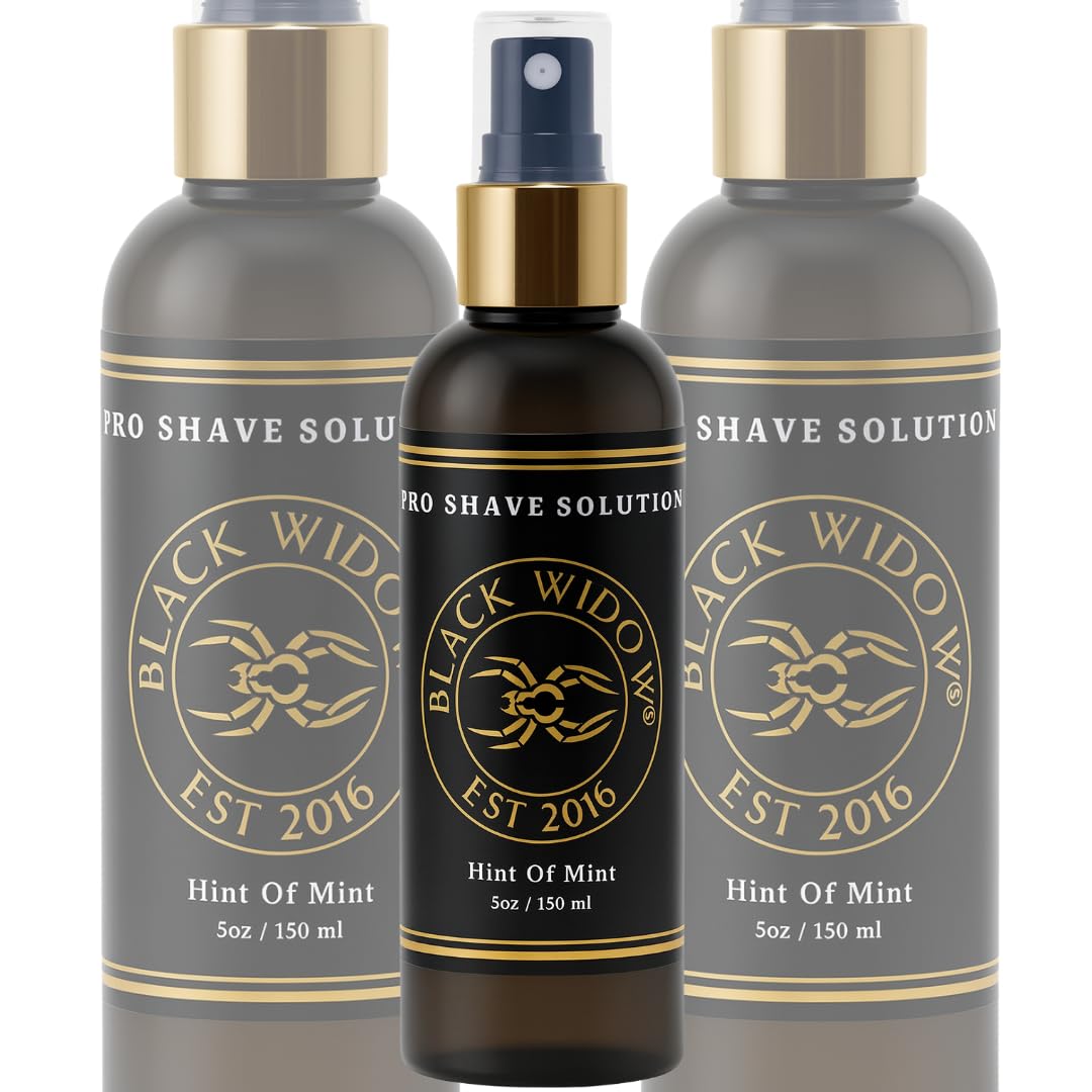 BLACK WIDOW Pro Shave Solution spray in use, delivering clear coverage during shave.