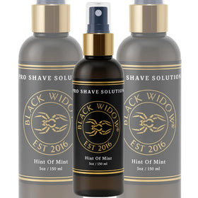 BLACK WIDOW Pro Shave Solution spray in use, delivering clear coverage during shave.