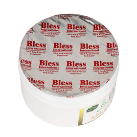 Bless International mango butter spread on skin showing moisturizing effect.
