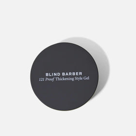 Hands emulsifying Blind Barber 121 Proof gel for quick, controlled application.