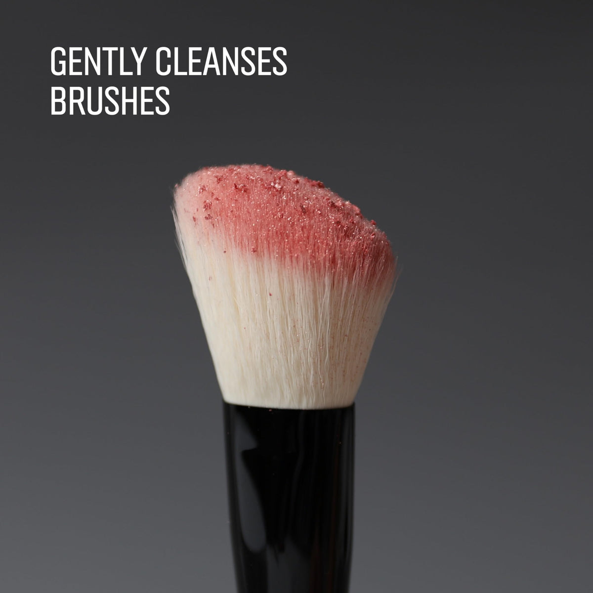 Bobbi Brown Conditioning Brush Cleanser applied on brush head for residue removal.