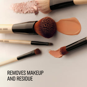 Bobbi Brown Conditioning Brush Cleanser rinsing makeup from bristles for freshness.