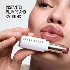 Bobbi Brown Extra Color Shine swirls on lips, delivering plump, smoothing color