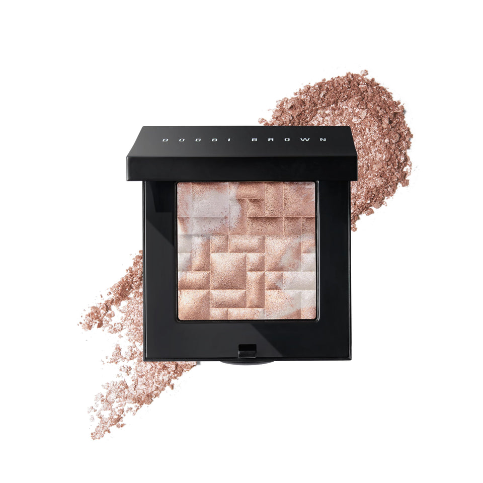 Bobbi Brown Highlighting Powder Pearl-Infused Pink Glow on cheek for luminous radiance.
