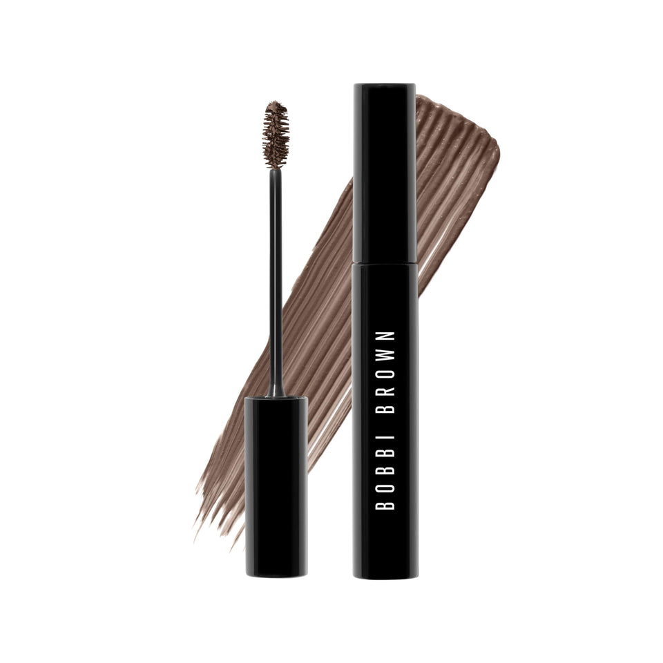 Bobbi Brown Natural Brow Shaper bottle and brush for precise shaping and light hold.