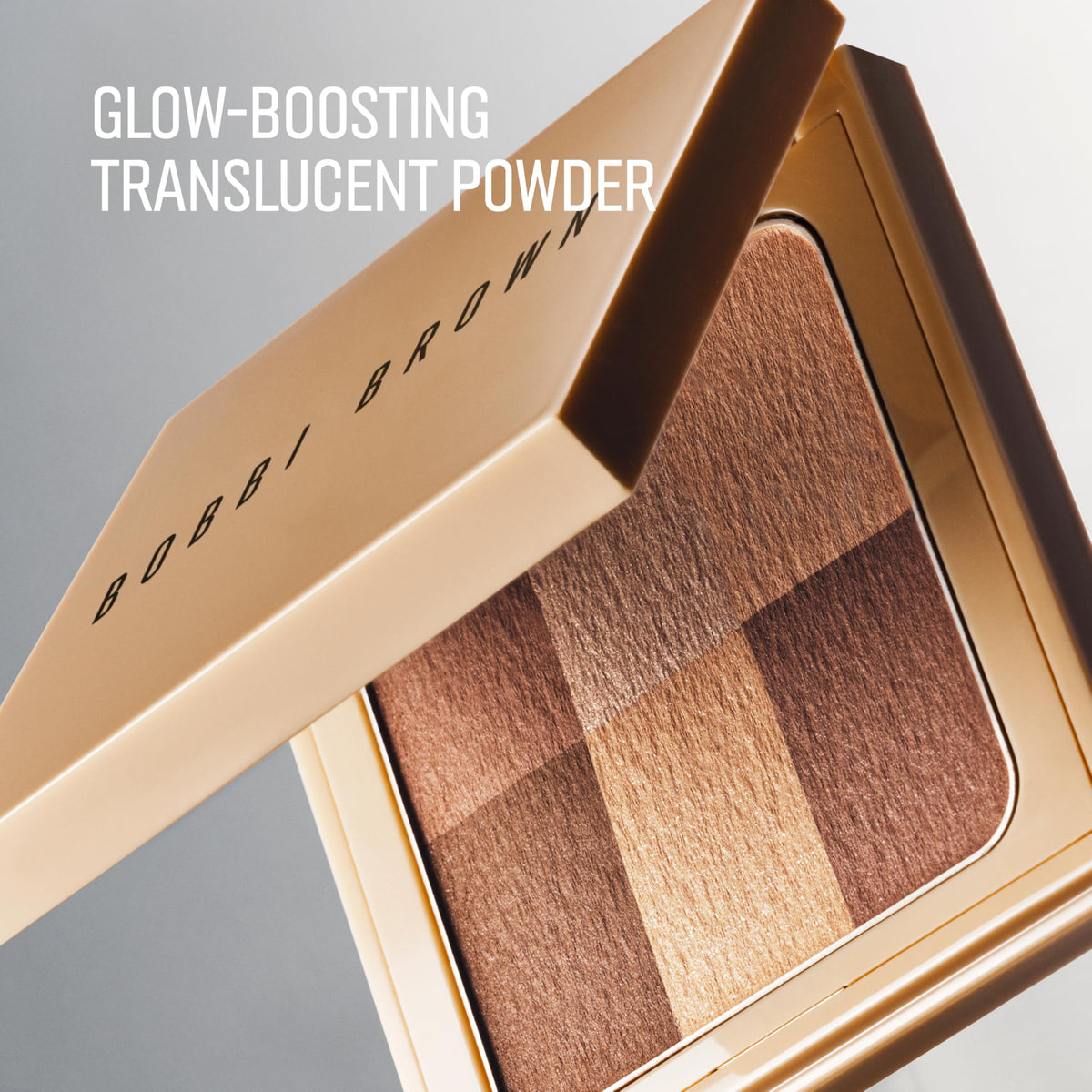 Close-up of Bobbi Brown Nude Finish Illuminating Powder jar showing pearlescent pigments.