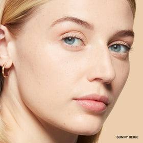 Bobbi Brown Sheer Finish pressed powder swirl to blur pores and even skin tone.