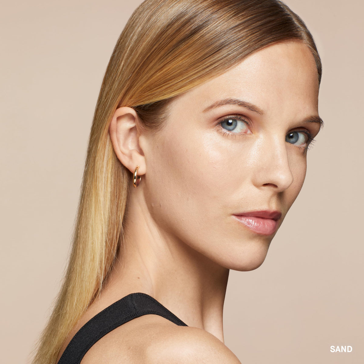 Bobbi Brown concealer stick blending seamlessly with foundation.