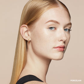 Bobbi Brown concealer applied around the eyes to even discoloration for a natural look.