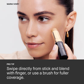 Bobbi Brown Skin Foundation Stick spread on cheeks for even tone.