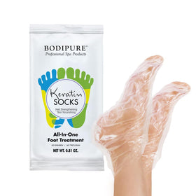 Bodipure All-In-1 Foot Mask worn as disposable socks for at-home foot care.