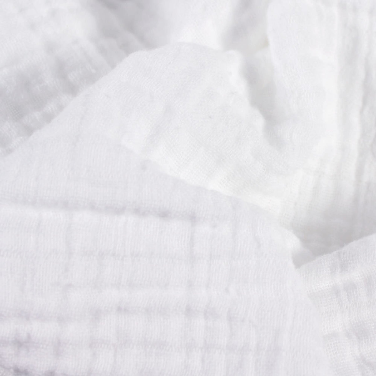 Body Linen Muslin Facial Cloths shown in towel warmer for spa-like steam.