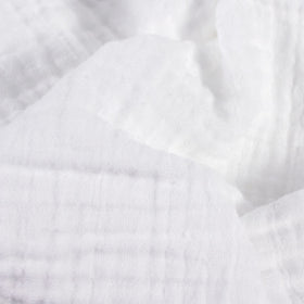 Body Linen Muslin Facial Cloths shown in towel warmer for spa-like steam.