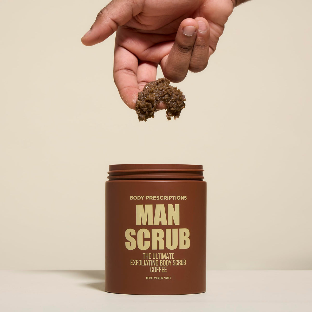Coffee granules close-up in Body Prescriptions exfoliating scrub.